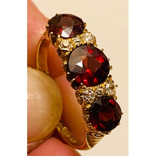 223 - 18ct GOLD RING SET WITH ONE GARNET APPROX 1.75ct, TWO GARNETS APPROX 1ct, FOUR DIAMONDS APPROX 0.04c... 