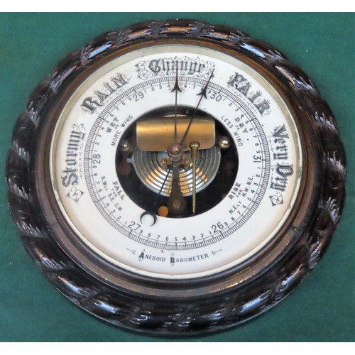 154 - Early 20th century oak cased aneroid barometer with enamelled dial. App. 27cm Diameter