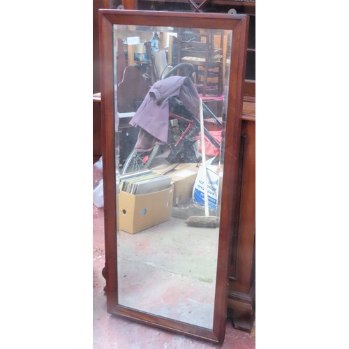 145 - Early 20th century bevelled mahogany wall mirror. Approx. 112 x 48cm