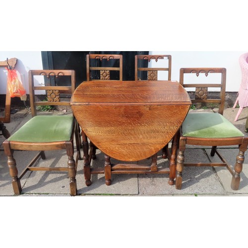 265 - Early 20th century oak gateleg dining table, plus four carved dining chairs.