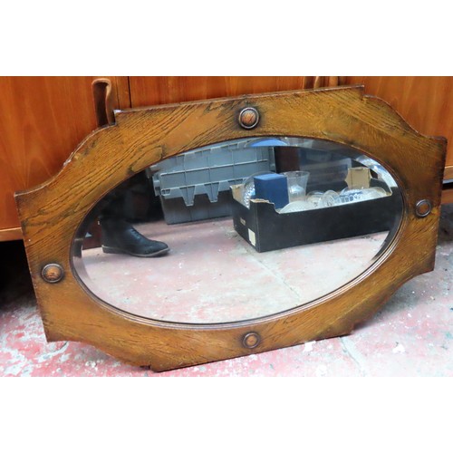 245 - Early 20th century oak bevelled wall mirror. Approx. 56 x 83.5cm