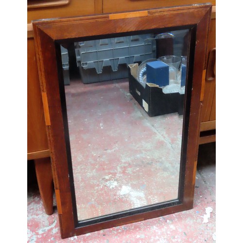 239 - Early 20th century inlaid oak bevelled wall mirror. Approx. 74 x 48cm