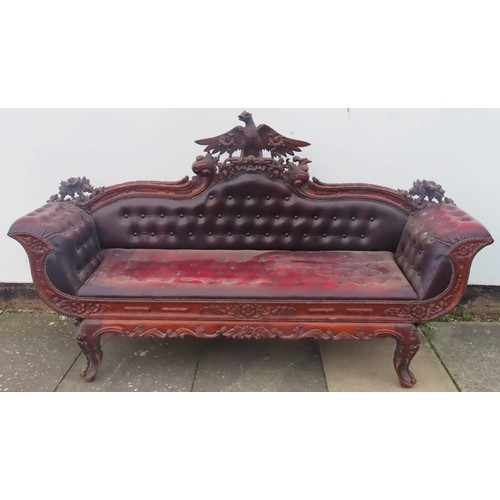 1 - Heavily carved mahogany framed upholstered leather chaise longue. Approx. 104cm H x 215cm W x 61cm D