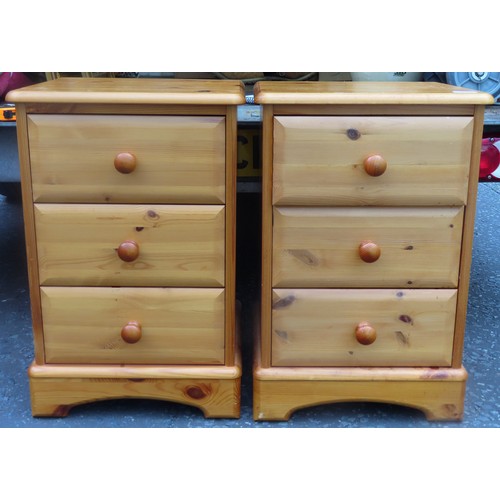 153 - Pair of 20th century three drawer pine bedside chests. Approx. 61cms H x 41cms W x 31cms D