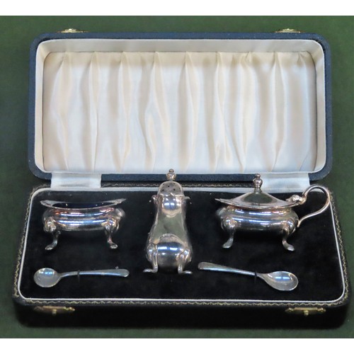 209 - Cased silver plated three piece cruet set with spoons and blue glass liners