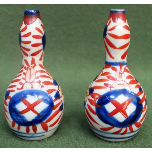 243 - Pair of miniature 19th century Oriental double Gourd vases, hand painted in the Imari palate. Approx... 