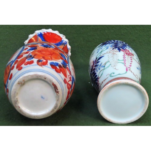 178 - Two Oriental hand painted ceramic vases. Larger Approx. 21cms H