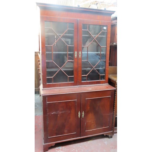 15 - 19th century astragal glazed mahogany two door bookcase, with cupboard doors below. Approx. 199cm H ... 