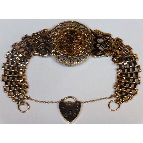 317 - George V Gold full sovereign within pretty 9ct gold bracelet setting. Total weight. 29.1G