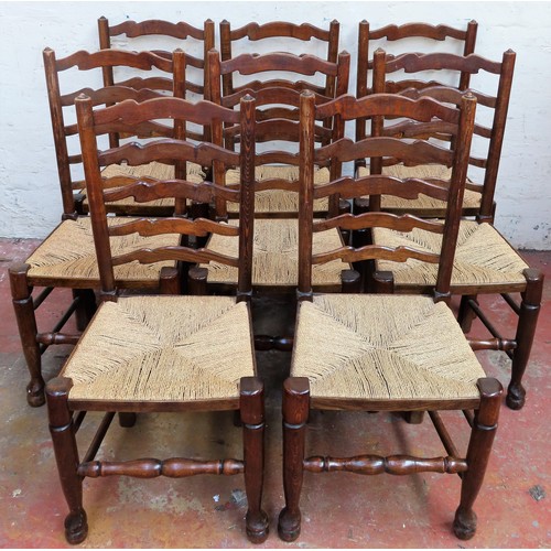 141 - Set of Eight 19th century rush seated oak ladderback chairs, on stretchered supports. Approx. 101cm ... 