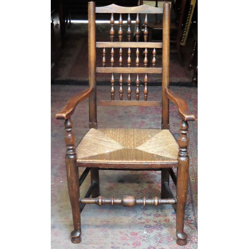 152 - 19th century Oak Spindle back rush seated armchair App. 109cm H x 61cm W x 44cm D