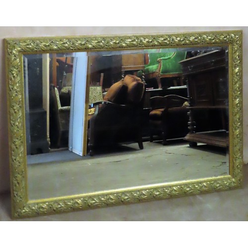 62 - Large 20th century gilded and bevelled wall mirror with grape and vine decoration. Approx. 97 x 136c... 