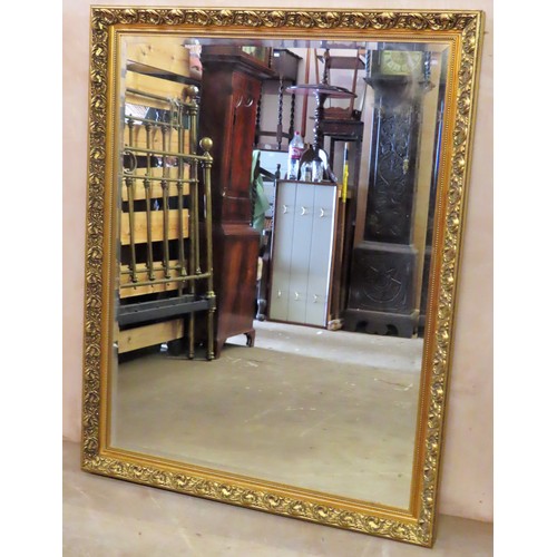 74 - Large 20th century gilt framed and bevelled wall mirror. Approx. 130 x 102.5cm