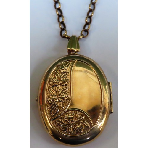 300 - 9ct gold oval double locket, on 9ct gold chain. Approx. 8.5g