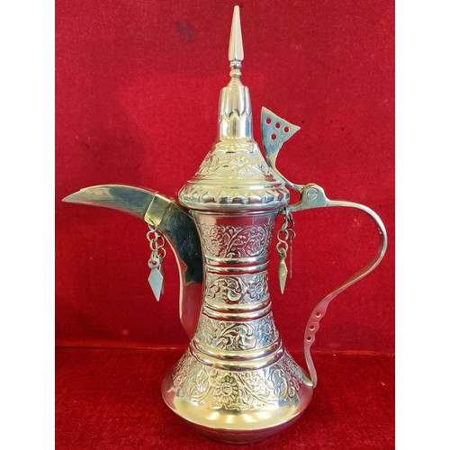 17 - OMANI STYLE SILVER COLOURED COFFEE POT/DALLAH, STAMPED 23 TO HANDLE. APP. 31.5CM H. WEIGHT APP. 525.... 