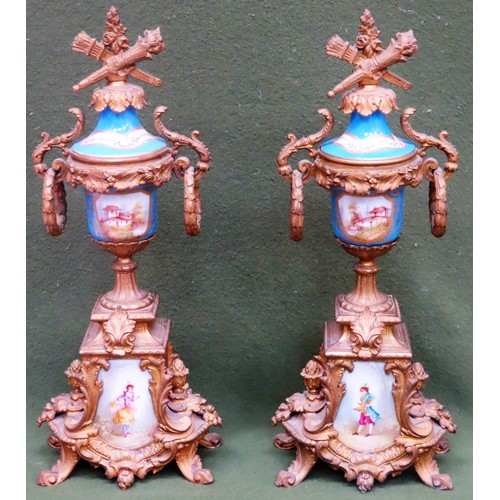 16 - Pair of 19th century ornate gilt metal clock garnitures, with handpainted porcelain panels throughou... 