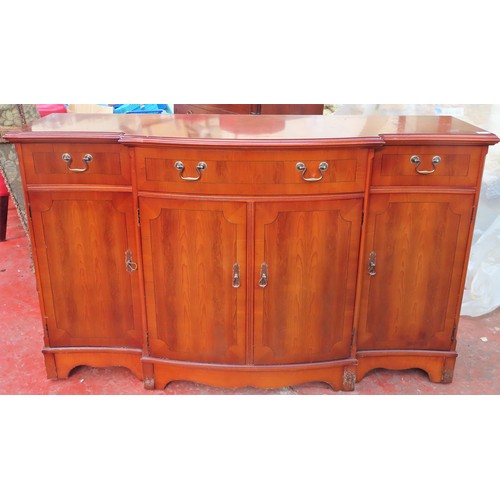 256 - Strongbow 20th century yew wood breakfront sideboard. App. 86cm H x 138cm W x 44cm D