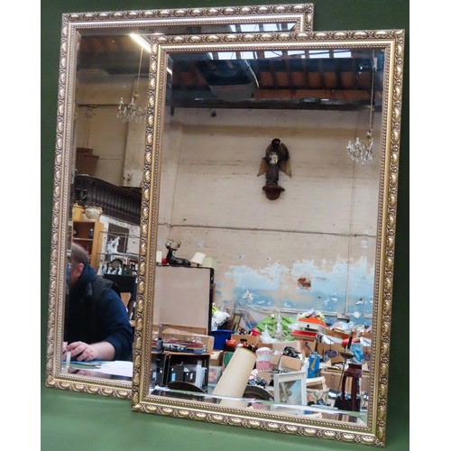 37 - Two large gilt framed and bevelled wall mirrors