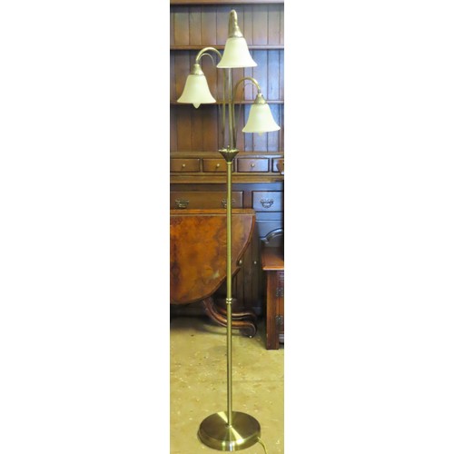 143 - 20th century three branch standard lamp with glass shades. App. 166cm H