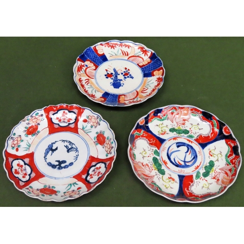 70 - Three various Oriental wave edged ceramic plaques, all in the imari pallette. App. 22cm Diameter