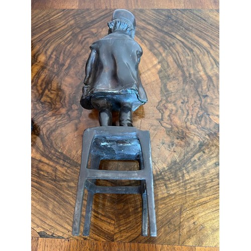 176 - BRONZE FIGURE OF A CHILD STANDING ON A STOOL, CIRCA 1900. APPROX. 31CM H