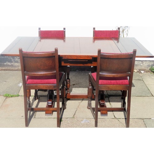 30 - Early 20th century oak draw leaf dining table, with four carved oak upholstered dining chairs. Table... 