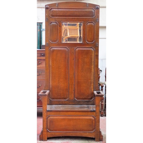 21 - Early 20th century panelled oak hall stand with lift up seat. App. 203cm H x 92cm W x 31cm D