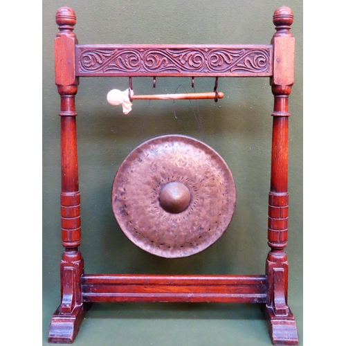 10 - Early 20th century carved fronted oak mounted brass circular gong with striker. Approx. 84cms H x 63... 