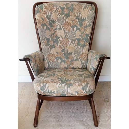 63 - Ercol mid 20th century upholstered stick back armchair. App. 100cm H x 76cm W x 55cm D