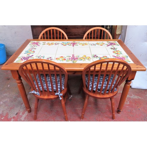 57 - 20th century pine tile topped kitchen table plus four chairs. App. 76cm H x 139cm W x 79cm D