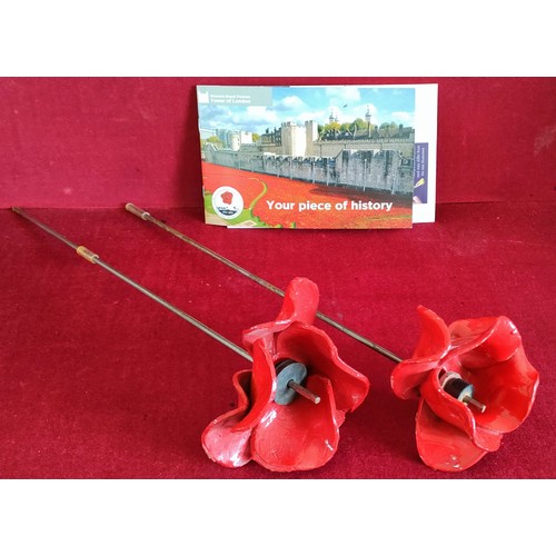 323 - TWO CERAMIC POPPIES ON METAL STEMS BY PAUL CUMMINS, FROM THE 