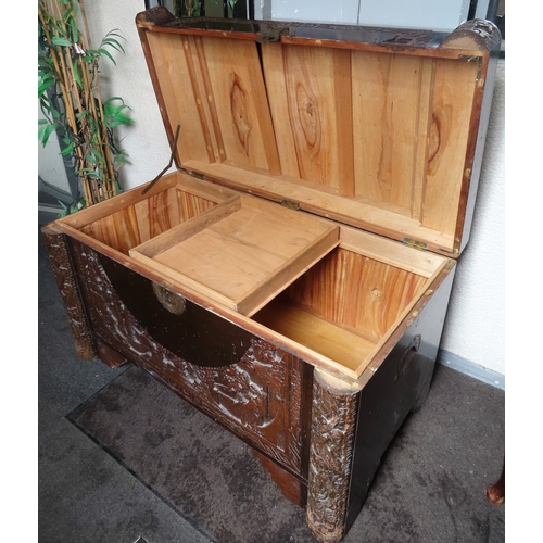 24 - Early/mid 20th century heavily carved Oriental Camphor chest. Approx. 60cms H x 102cms W x 54cms D