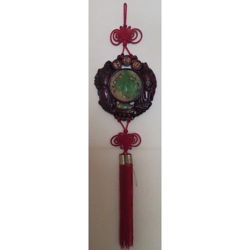 106 - 20th century Oriental resin wall hanging with tassles