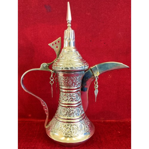 360 - OMANI STYLE SILVER COLOURED COFFEE POT/DALLAH, STAMPED 23 TO HANDLE. APP. 31.5CM H. WEIGHT APP. 525.... 