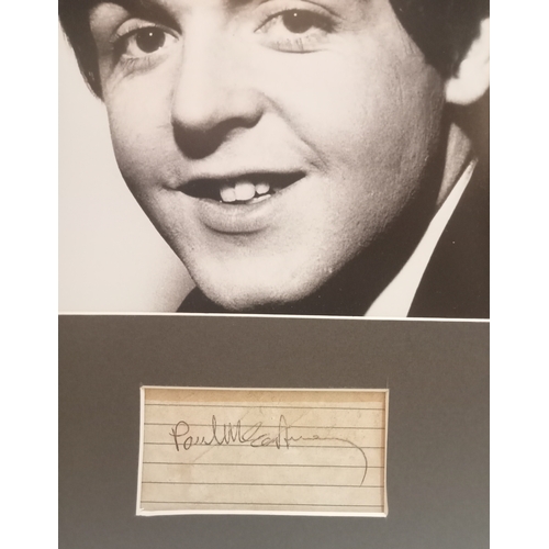 55 - Paul McCartney signature on lined paper mounted with black & white photograph.