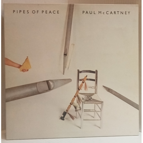 64 - A collection of Paul McCartney records including Spies Like Us 12” Picture Disc, Ebony & Ivory 12”, ... 