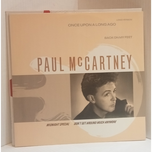 65 - A collection of records Including Paul McCartney Ebony & Ivory 12”, Paul McCartney Once Upon A Long ... 