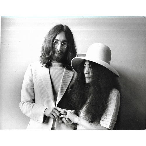 98 - Two original vintage John Lennon & Yoko Ono photographic prints by Camera Press Ltd at their wedding... 