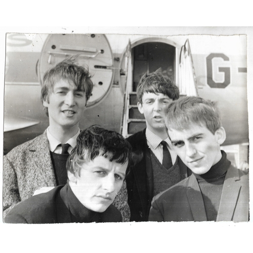 103 - Original vintage photograph of The Beatles at Speke Airport, hand written on reverse “Beatles going ... 