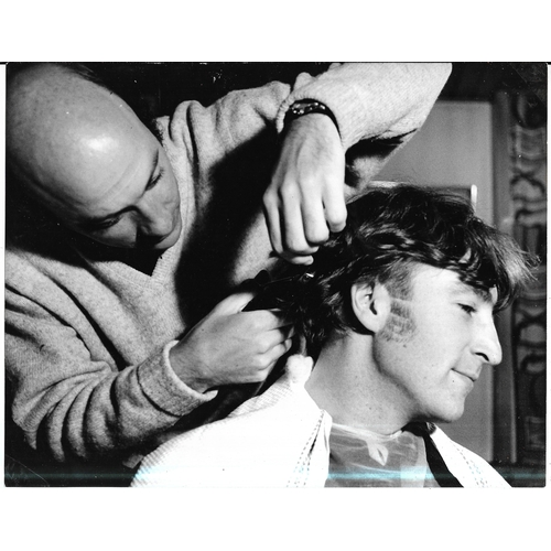 107 - Four original photographs of John Lennon, two feature John getting his haircut prior to filming of H... 