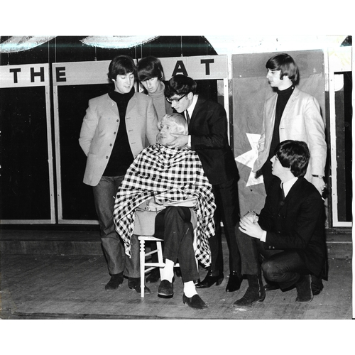 115 - Four original photographs of The Beatles, two from The Beatles Christmas Show and marked on reverse ... 