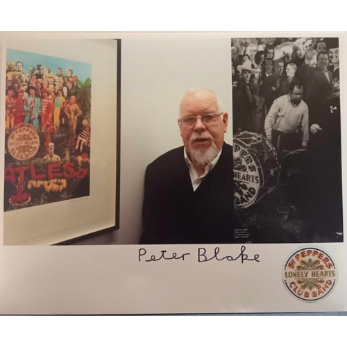 126 - Peter Blake signed photograph of him with various Sgt Pepper images