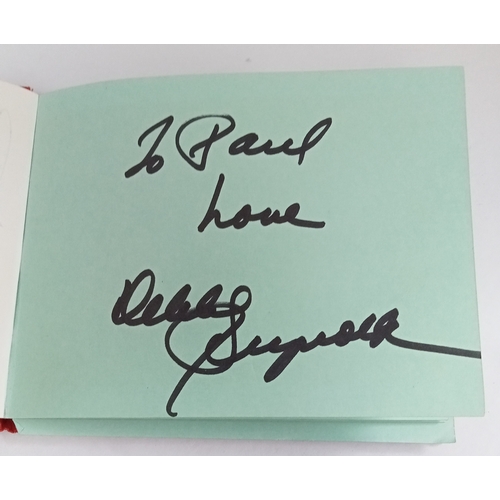 159 - Autograph book including Bob Wooler x 2, Roger McGuinn, Peter Noone, Debbie Reynolds and others.