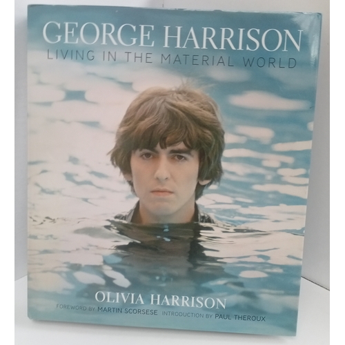 168 - George Harrison Living In The Material World book signed by Olivia Harrison.