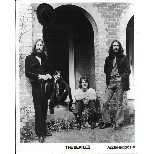 279 - The Beatles 1969 Apple Promotional Photograph, photograph has signatures on reverse in an unknown ha... 