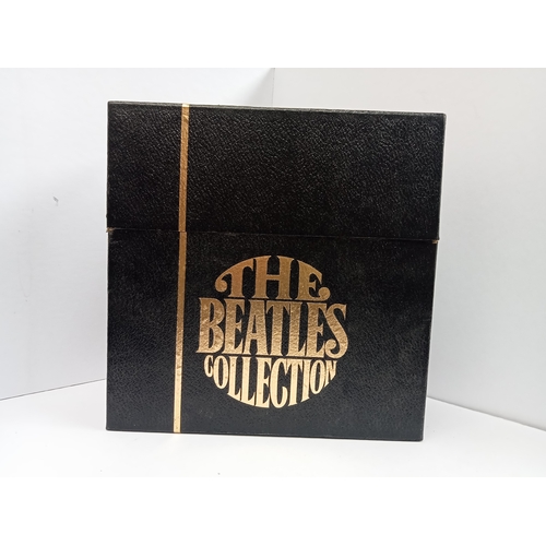 297 - The Beatles Collection singles box containing 24 Beatles singles in black box with fold print World ... 