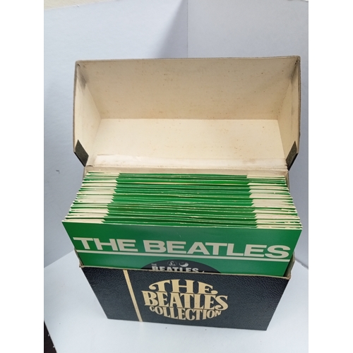 297 - The Beatles Collection singles box containing 24 Beatles singles in black box with fold print World ... 