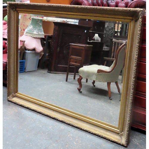 100 - Large 20th century gilt framed bevelled wall mirror. App. 113 x 143cm