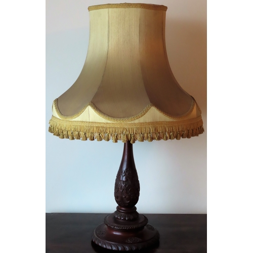 176 - Early 20th century heavily carved mahogany table lamp, with shade. Approx. 52cms H