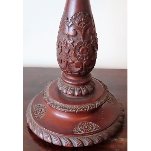 176 - Early 20th century heavily carved mahogany table lamp, with shade. Approx. 52cms H